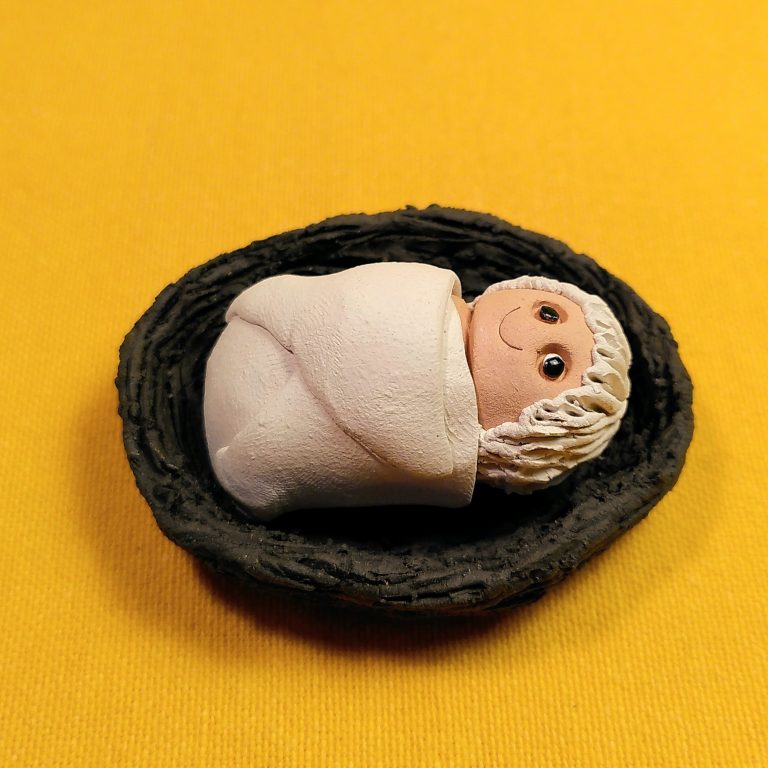 Wickelkind im Bettchen